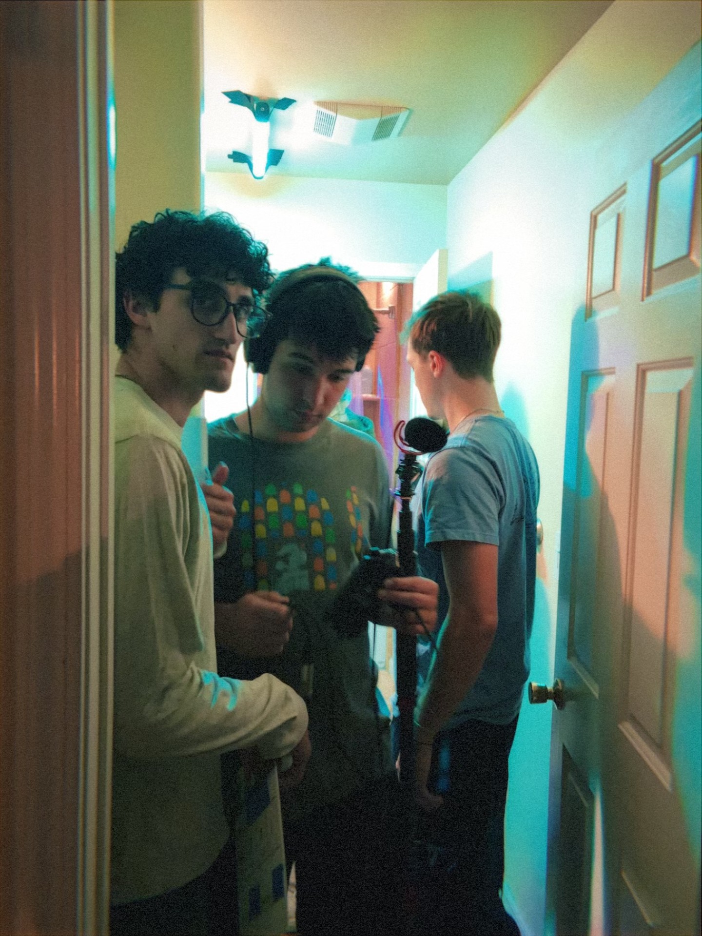 Hallway huddle · boom in hand