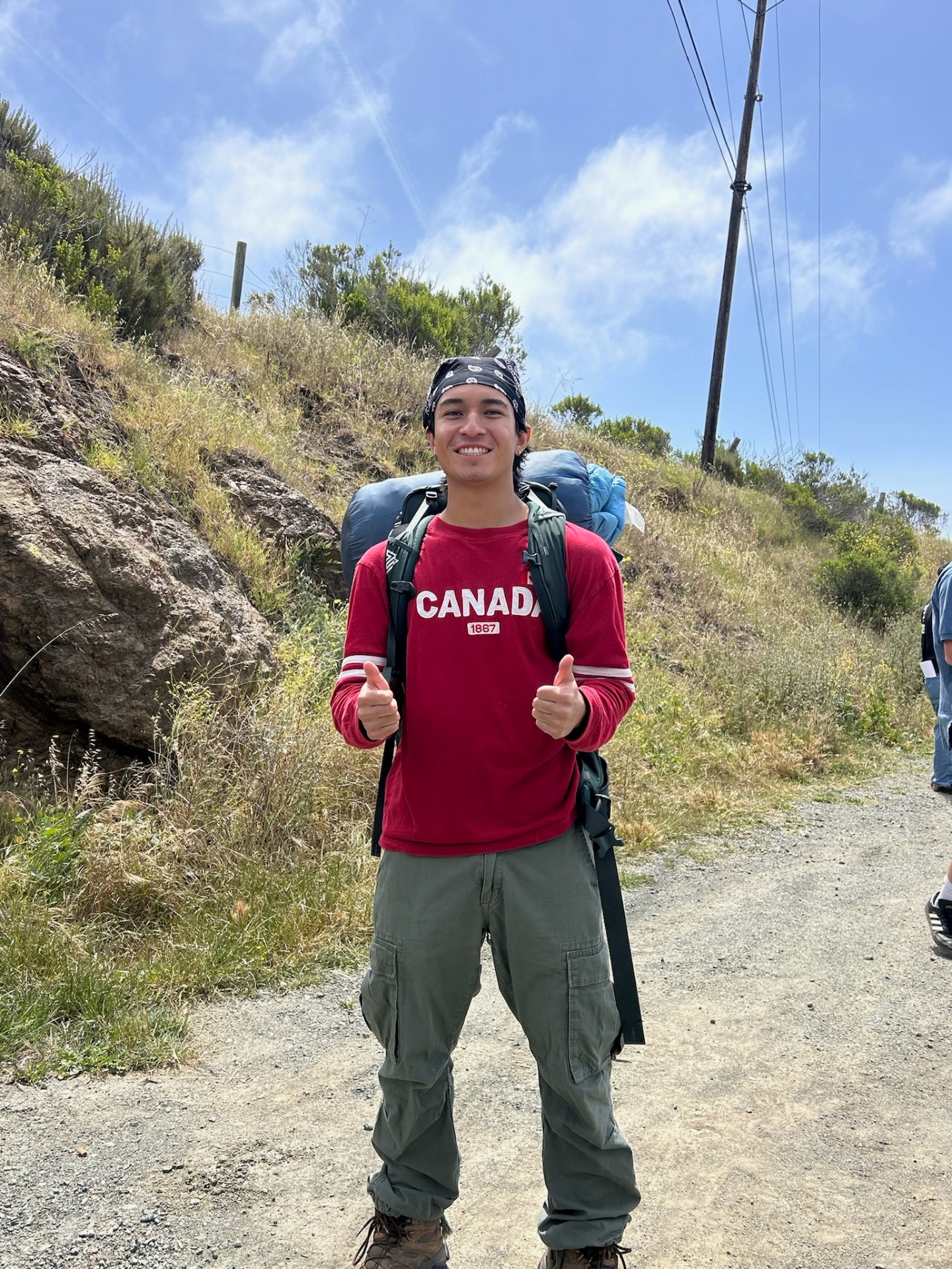 The Hitchhiker · thumbs up on the trail